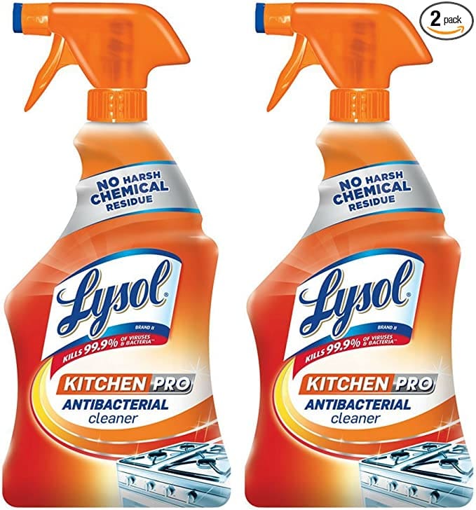 Two orange spray bottles of Lysol